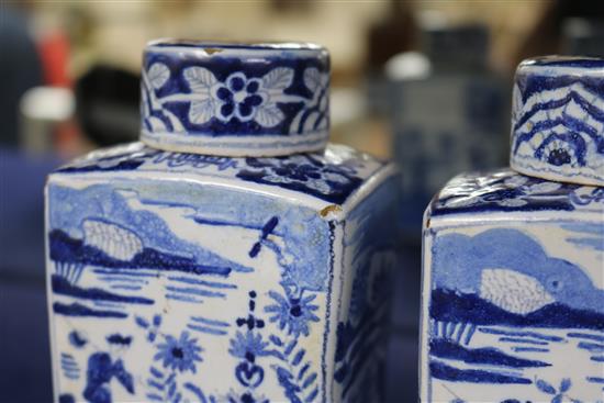A pair of Dutch delft blue and white lidded tea caddies